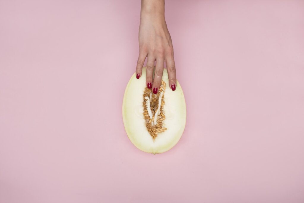 Person Holding a Sliced Melon